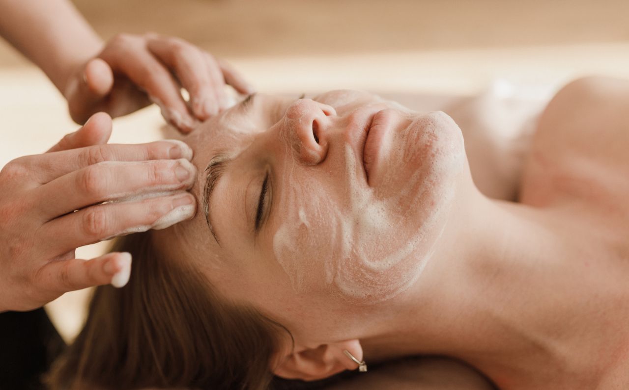 Woman receiving a facial treatment.