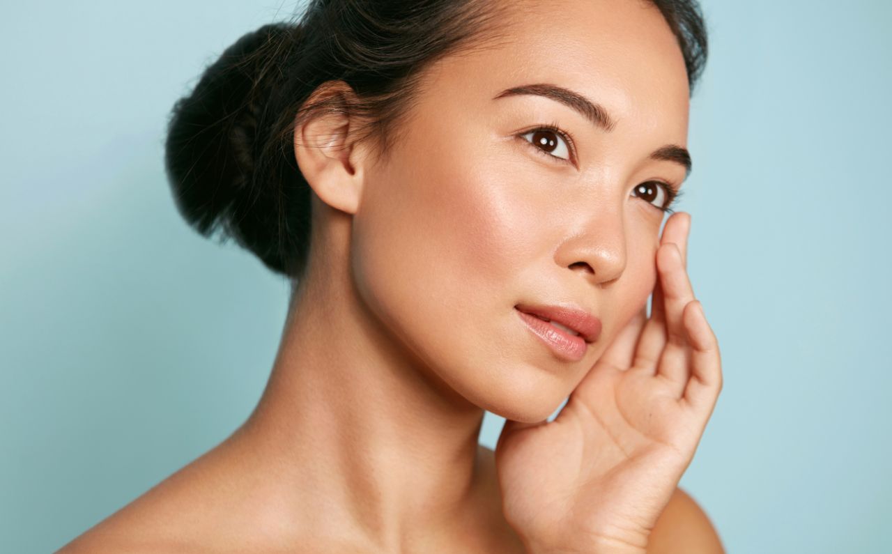 JuveLook treatment results on woman with glowing, youthful skin.