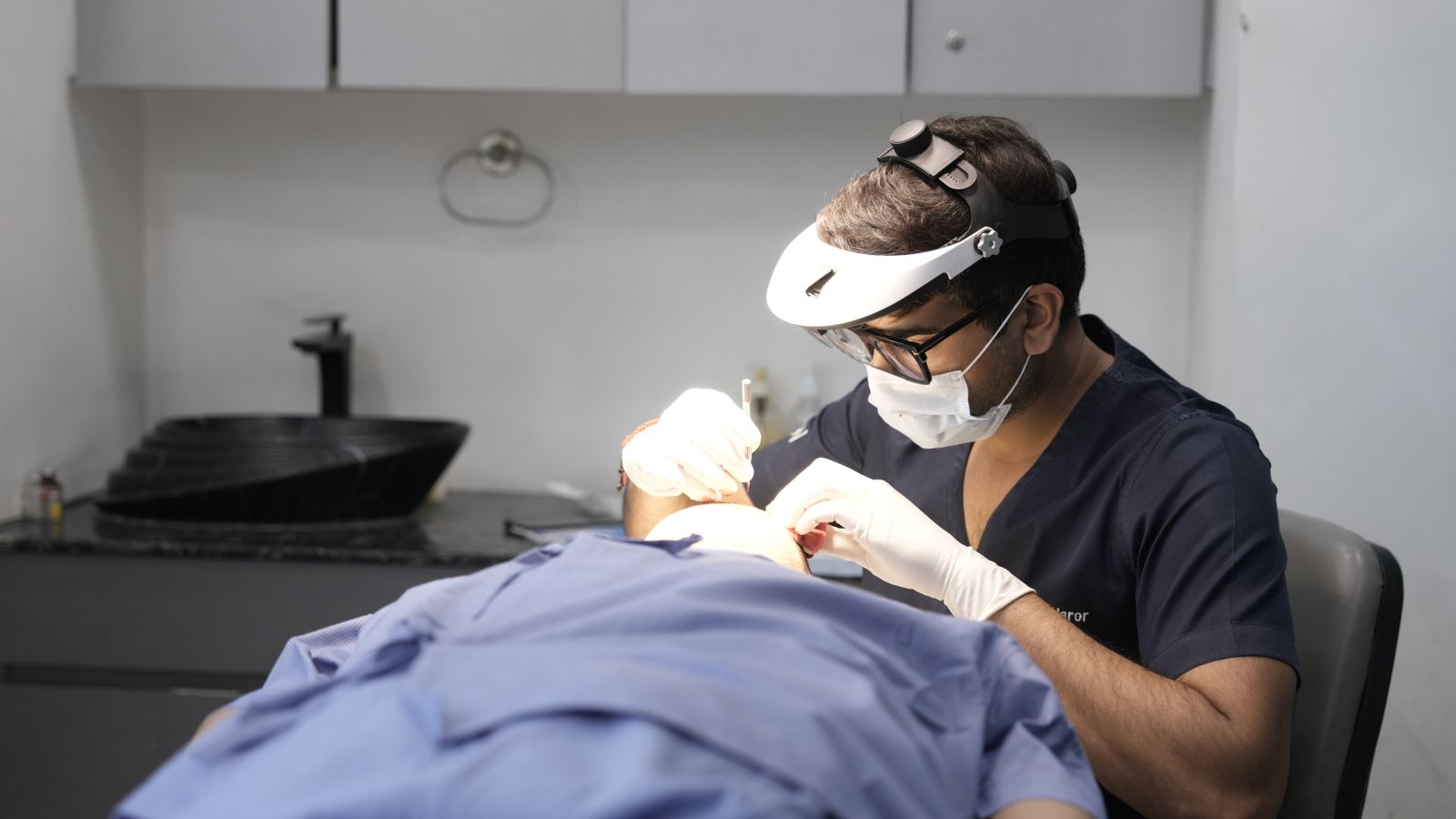 Medical practitioner performing a facial aesthetic treatment