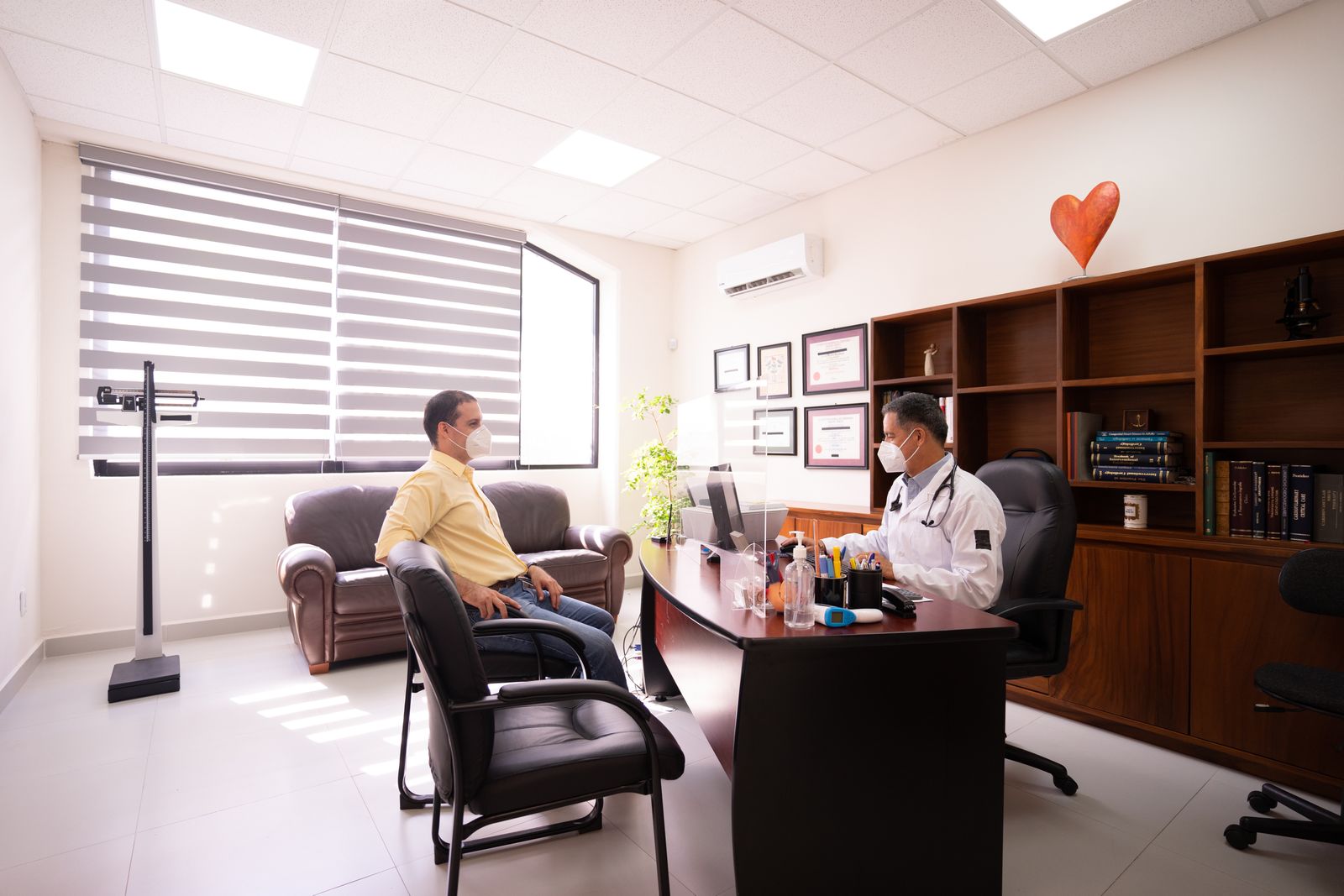 Patient discussing treatment expectations with a doctor in a clinic