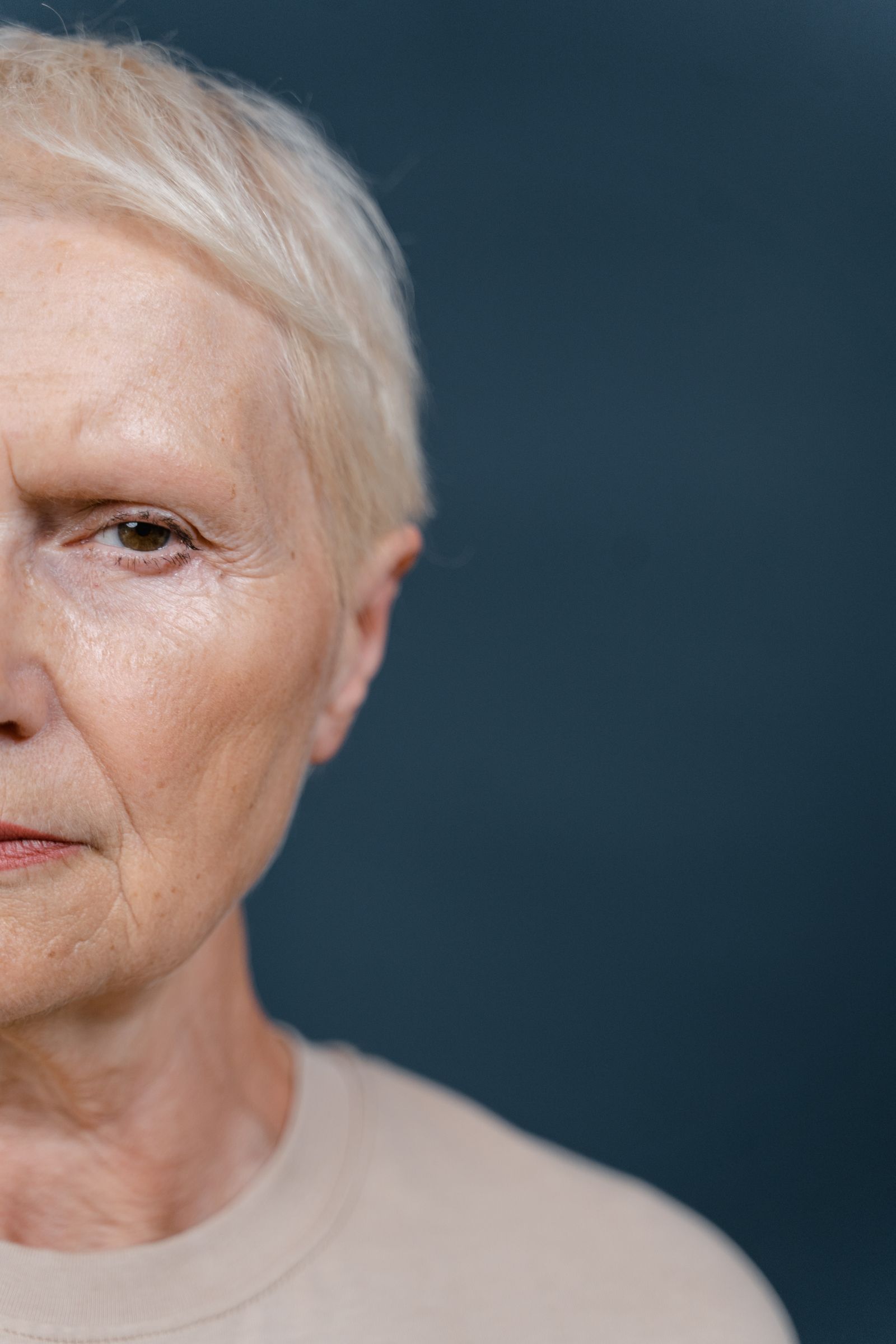 Close-up portrait showing natural facial lines and expression