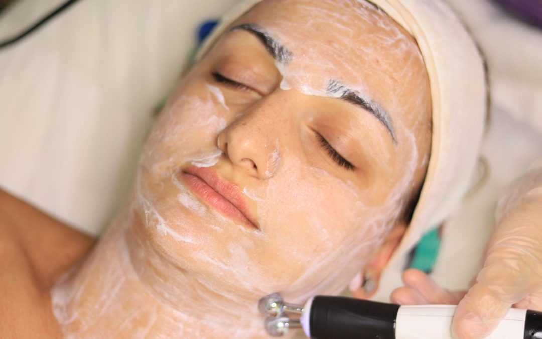 Patient receiving a non-invasive facial treatment in a skincare clinic