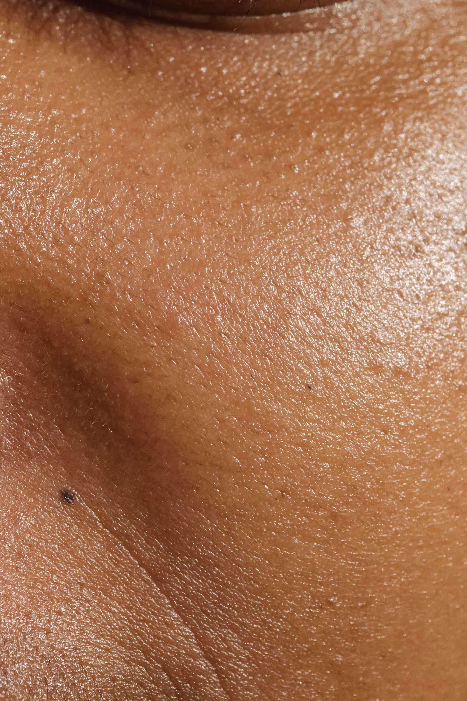 Detailed close-up of facial pores and natural skin texture