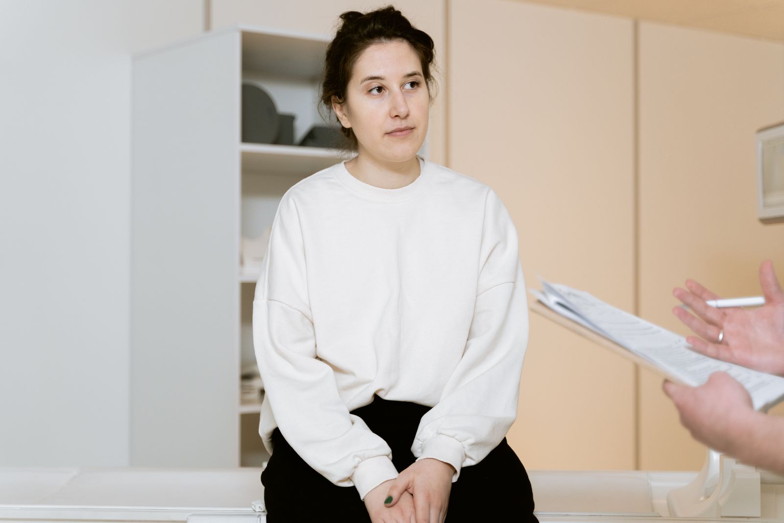 Woman listening during a medical consultation in a clinic