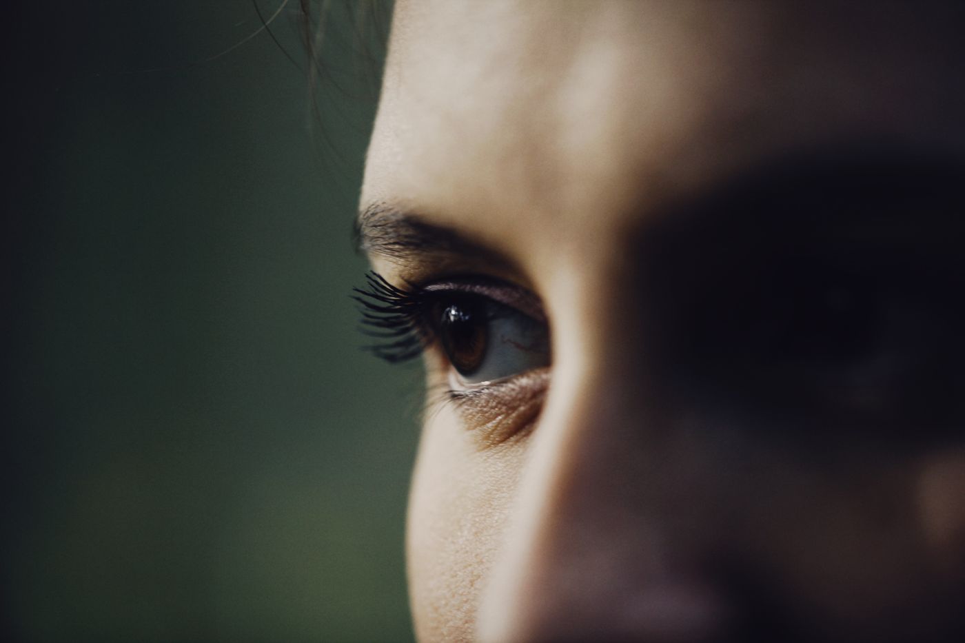 Close-up showing an eyelid, eyelashes and surrounding skin