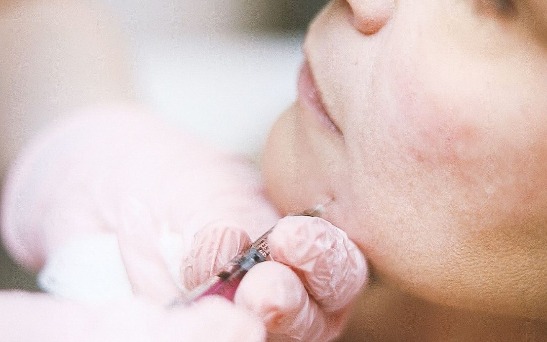 Close-up of a professional facial injection in a clinical setting