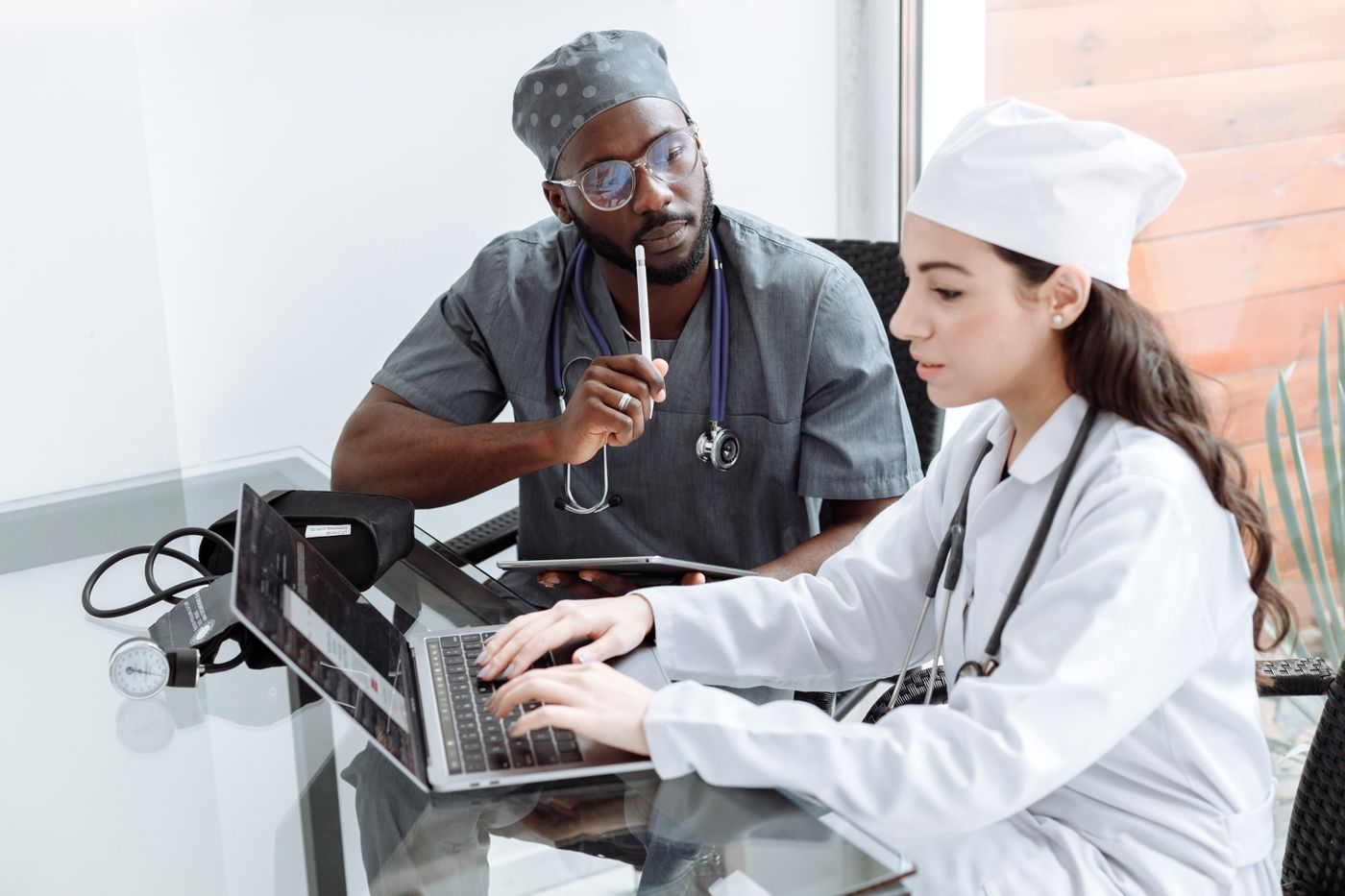 Doctors reviewing information together before making a treatment plan