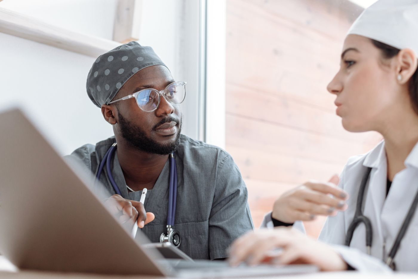 Healthcare workers discussing coordinated patient care