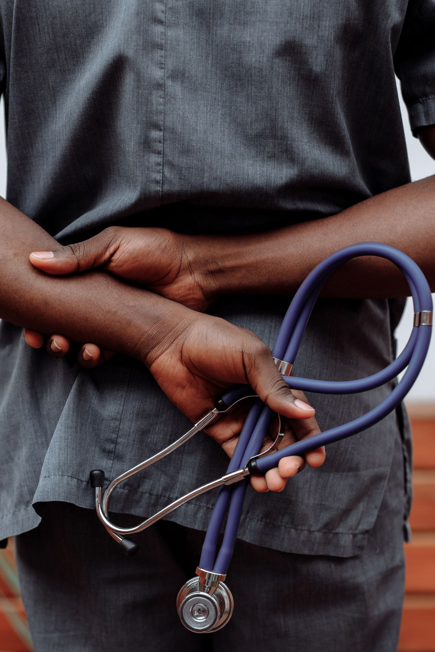 Healthcare professional holding a stethoscope for a medical review
