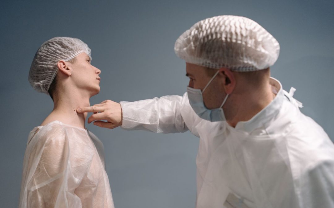 Doctor examining a patient's skin during a clinical assessment
