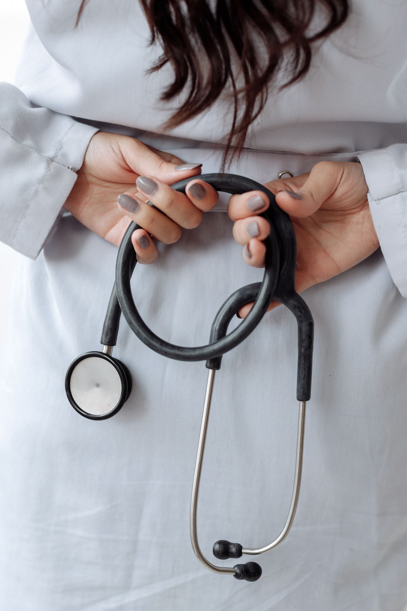 Doctor holding a stethoscope ready for a follow-up health assessment