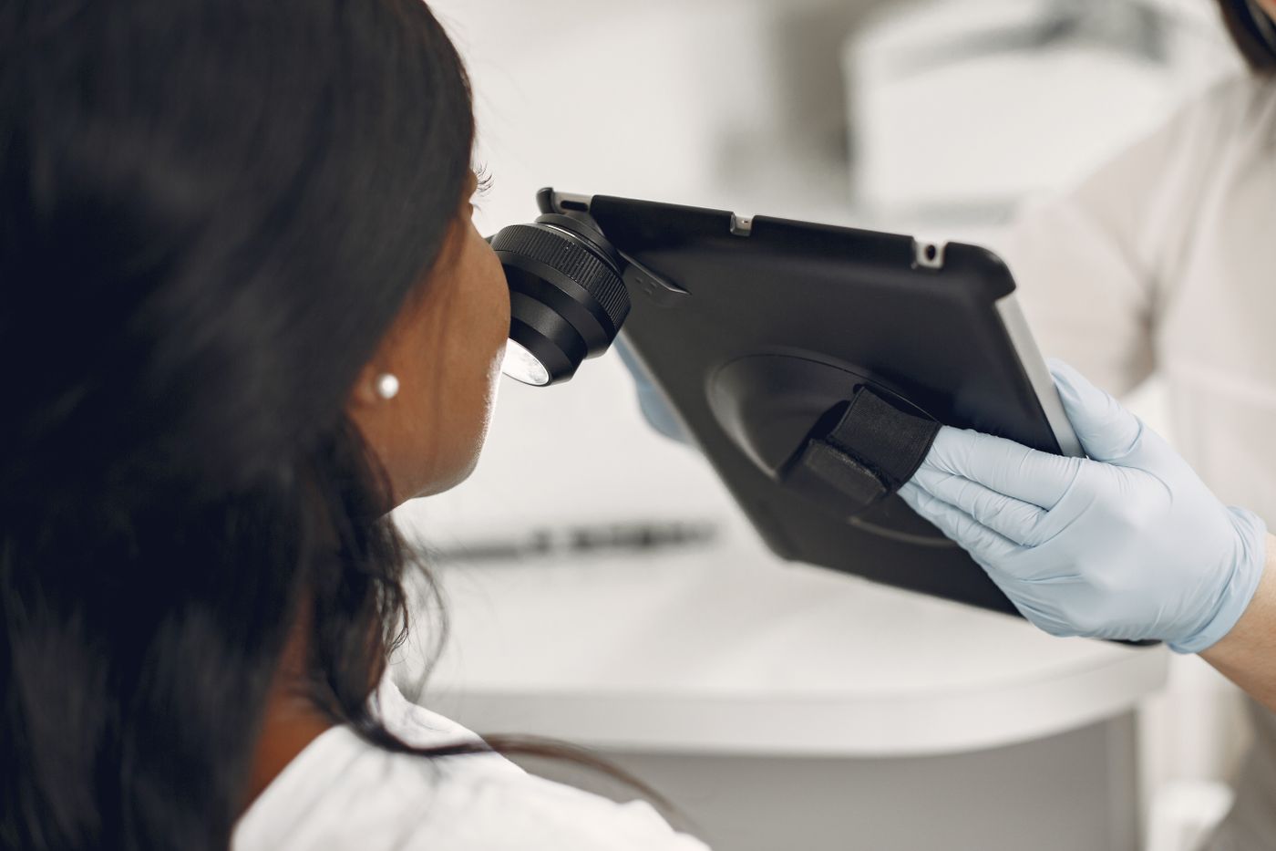 A digital magnifier used during a professional skin examination